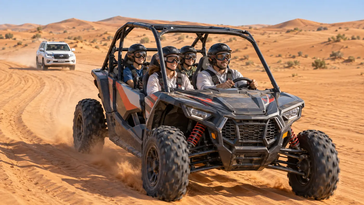 Family of four riding together in a four-seat dune buggy across the Dubai desert
