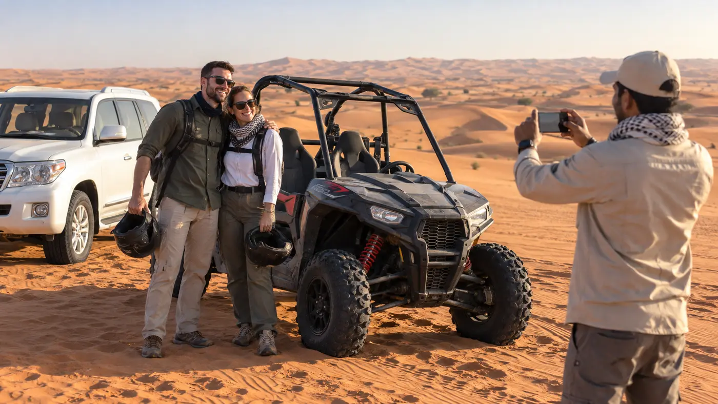 Couple posing beside a two-seat dune buggy while a guide takes their photo in Dubai